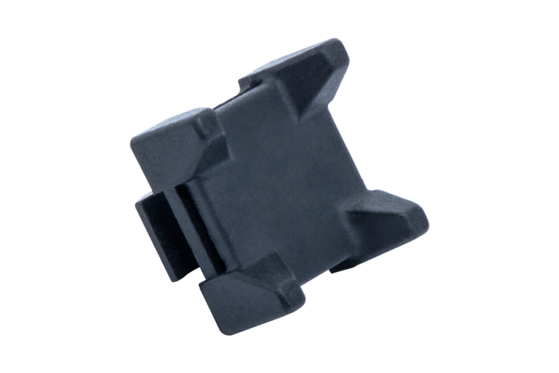Nylon-Kabelbinderblock als Halter für Kabel und Schläuche, passend für Aluminiumprofile mit Nutgrößen 6, 8 und 10 (System Item/Bosch)	 Rückansicht des Nylon-Kabelbinderblocks für Nutenprofile der Größen 6, 8 und 10 (Item/Bosch)