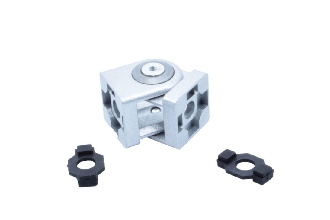 Gelenkverbinder 20 mm ohne Klemmhebel aus Zinkdruckguss, davor zwei schwarze Zentrierstücke