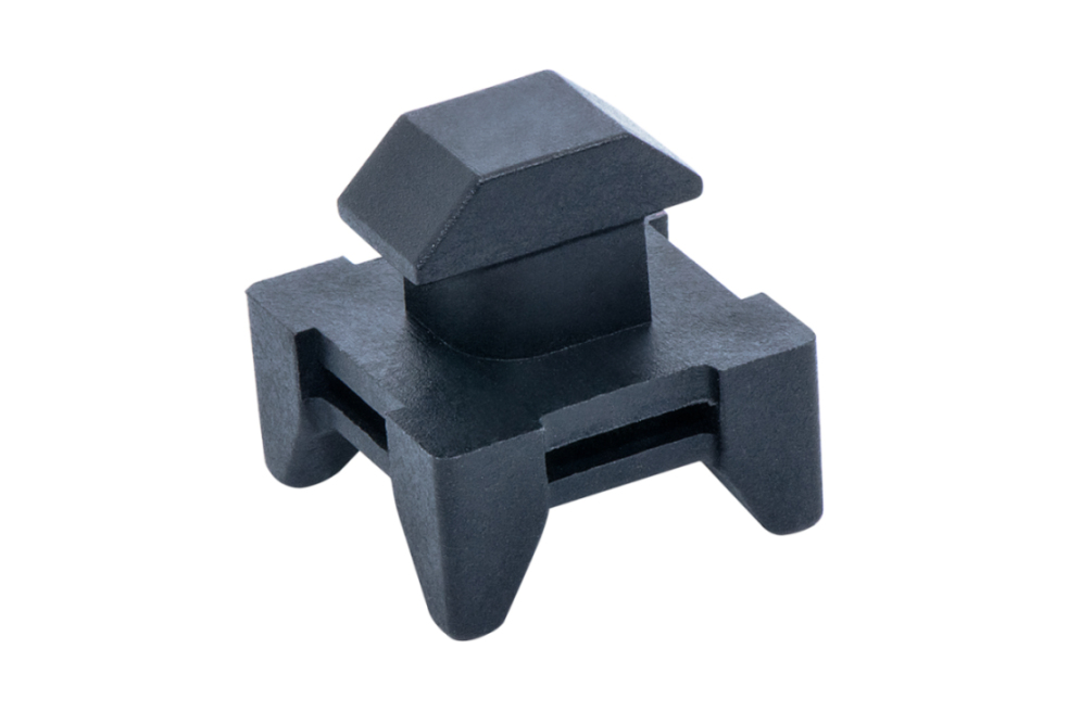 Kabelbinderblock aus Nylon zur sicheren Befestigung von Kabeln mit Kabelbindern an Aluprofilen der Systeme Item und Bosch (Nut 6/8/10)	 Draufsicht des Nylon-Kabelbinderblocks, passend für Nut 6, 8 und 10 (System Item/Bosch)